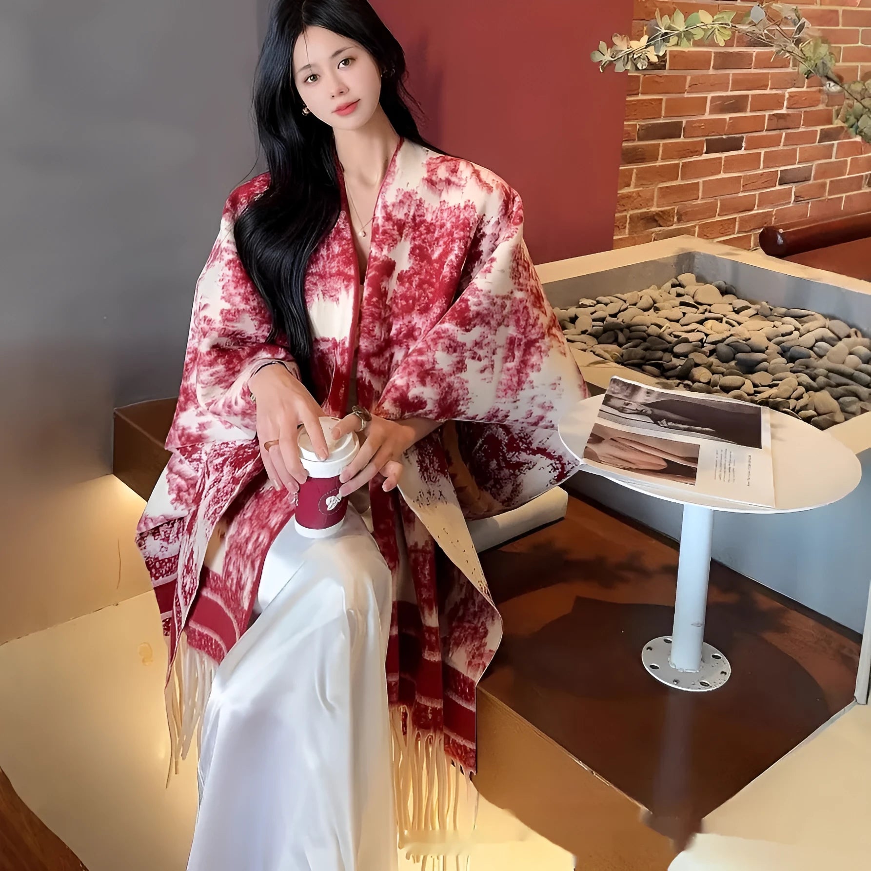 Women's personalised tassel scarf cape in polyester fabric showing decorative detailing