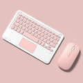 Pink mute wireless Bluetooth keyboard and mouse set with charging cable on a desk