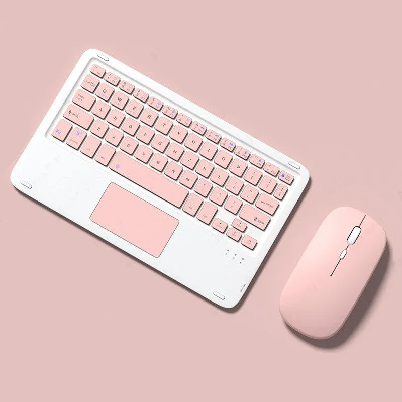Pink mute wireless Bluetooth keyboard and mouse set with charging cable on a desk