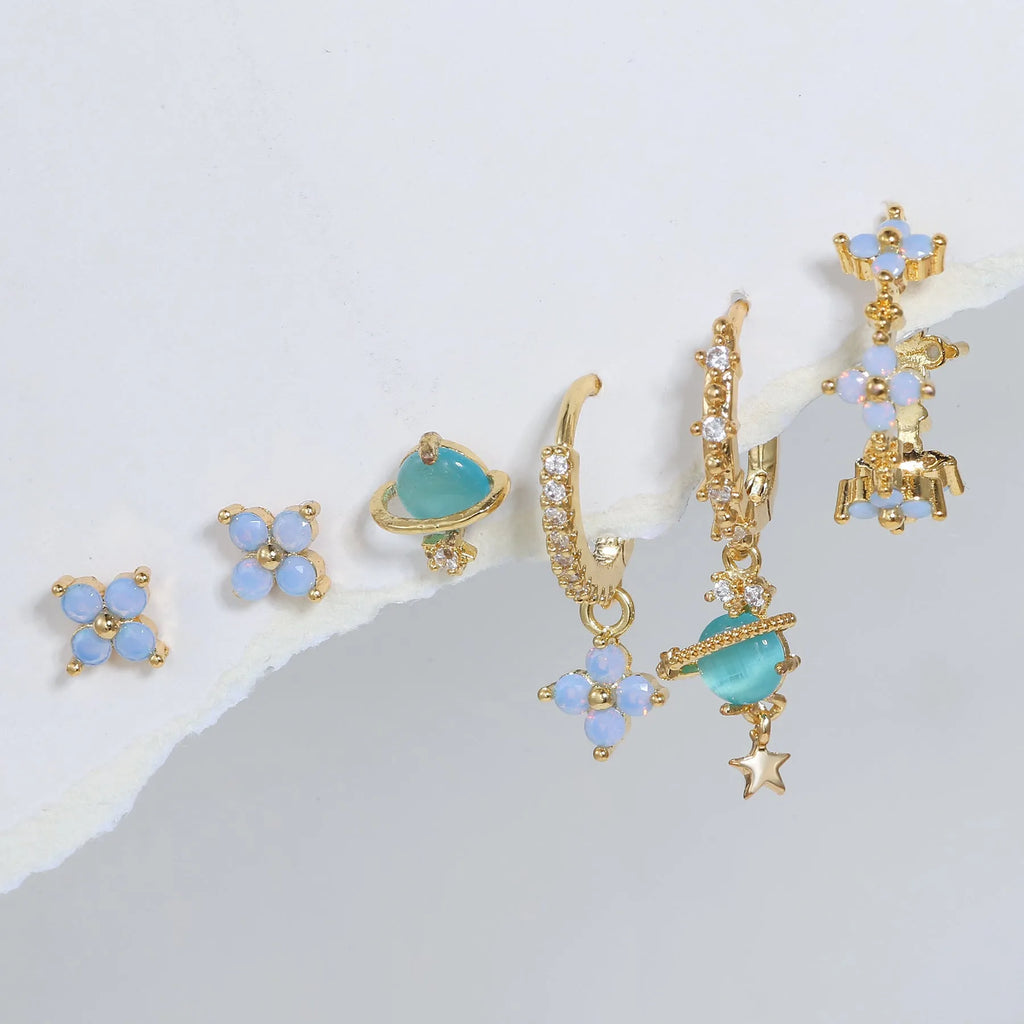 Gold and silver Japanese Korean style flower ear studs with blue flower nail and zircon mosaic design.