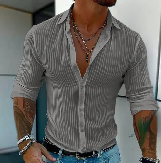 British-style loose fit men's striped long sleeve cardigan shirt on a hanger.