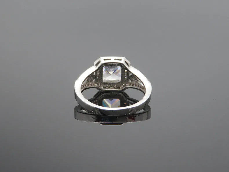 Women's platinum colour geometric zircon ring with hollow ornament design showing quadrilateral pattern