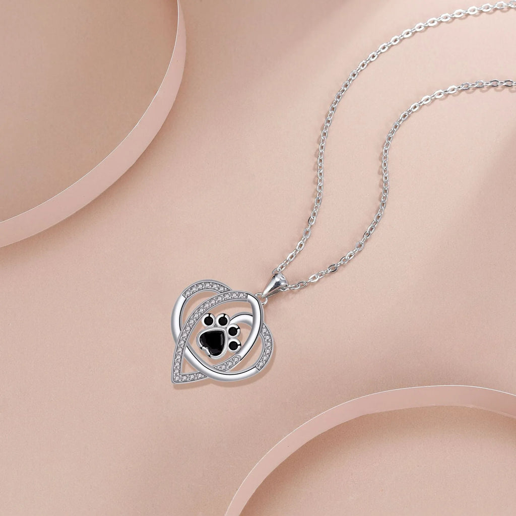 Women's copper necklace with dog and cat paw print pendant on cross chain