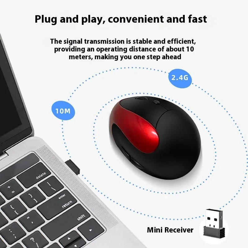 Wireless vertical ergonomic mouse in red colour on a desk next to a laptop.