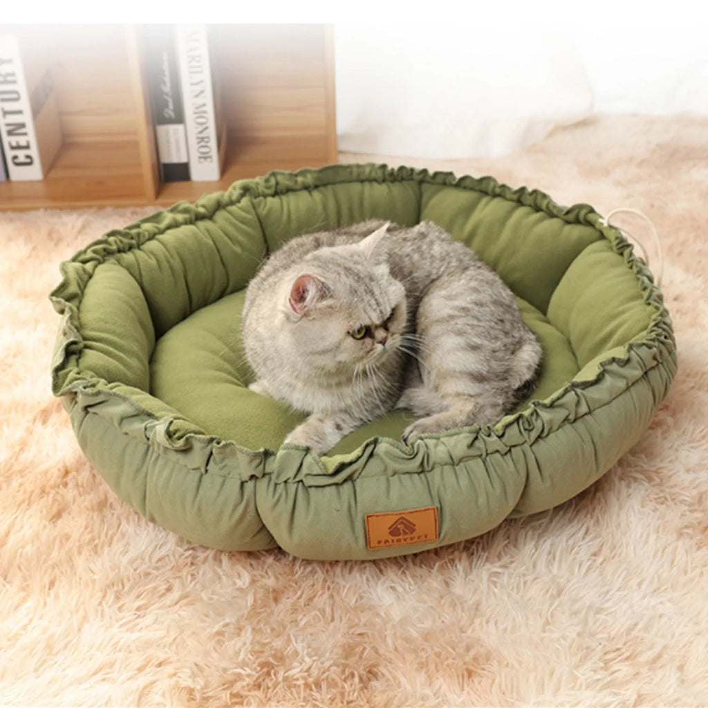 Grey and green reversible donut pet bed for cats and dogs with high sides.