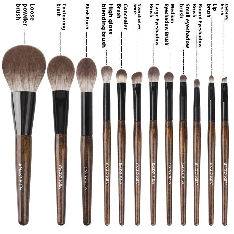 12 makeup brushes with wooden handles stored in a black PU roll, showing the powder foundation brush.