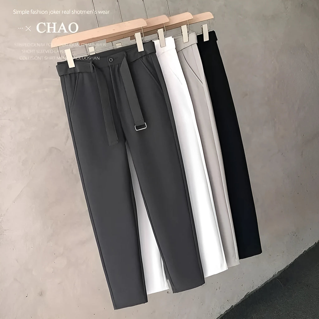Boys slim straight trousers in wool blend fabric on a hanger, showing tapered leg