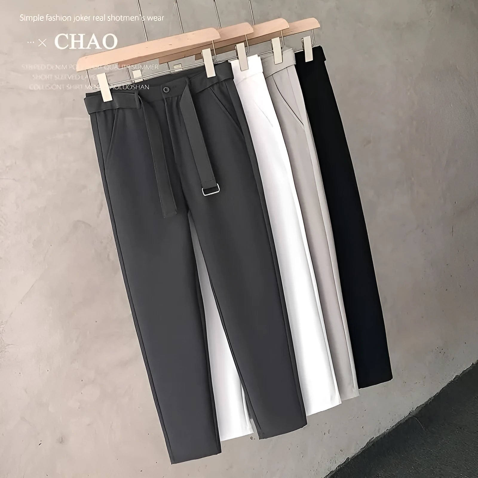 Boys slim straight trousers in wool blend fabric on a hanger, showing tapered leg