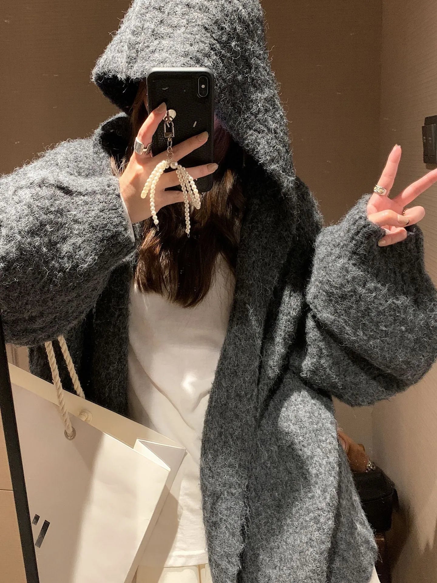 Women's dark grey retro Maillard hooded sweater cardigan with a thick knit texture.