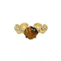 Women's adjustable silver ring featuring a shell and tiger eye stone with an electroplated gold tone finish.