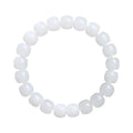 White Hetian jade barrel bead bracelet on a wrist, showing three bead size options.