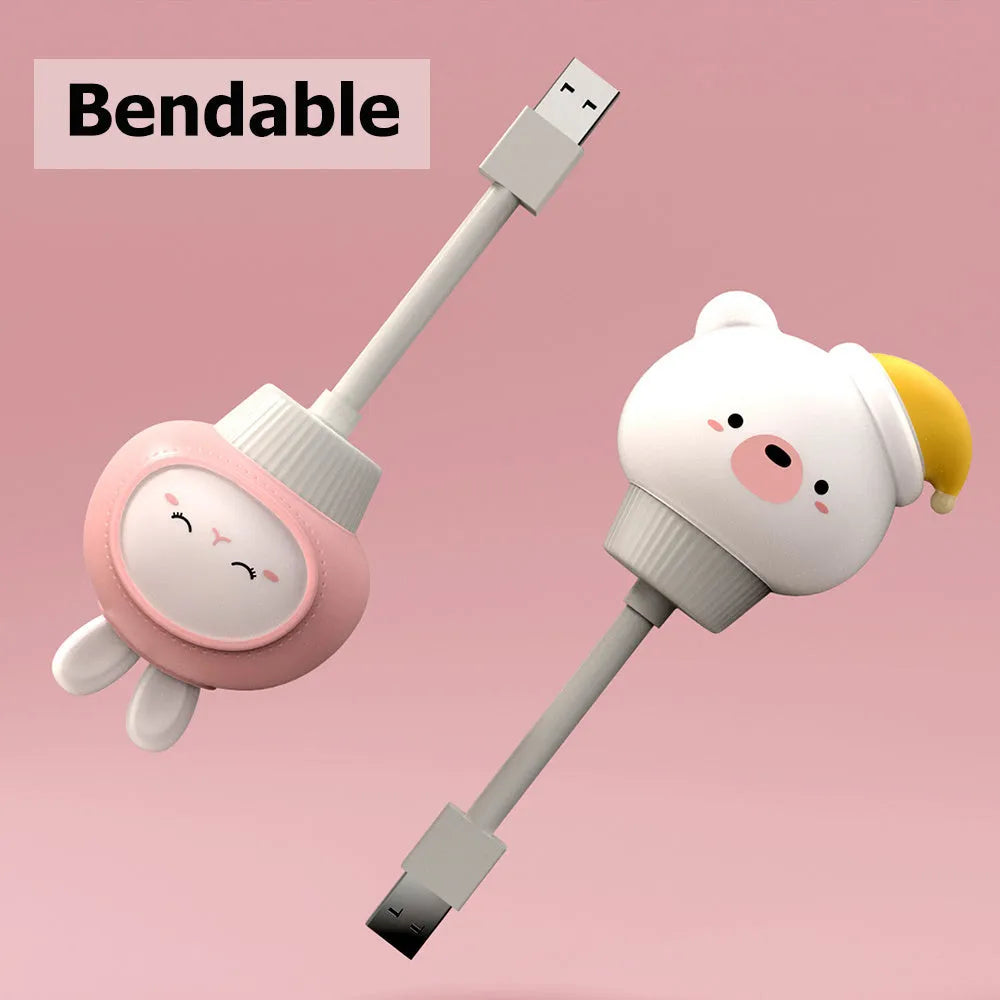 Cartoon animal USB night light in bear shape with remote control on a bedside table