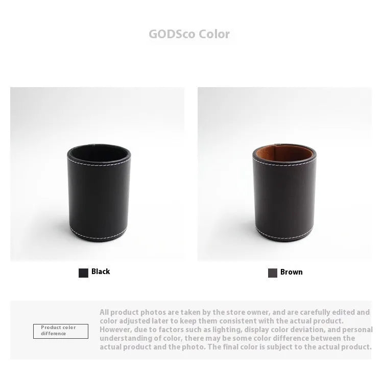 Small round black leather pen holder container on a desk