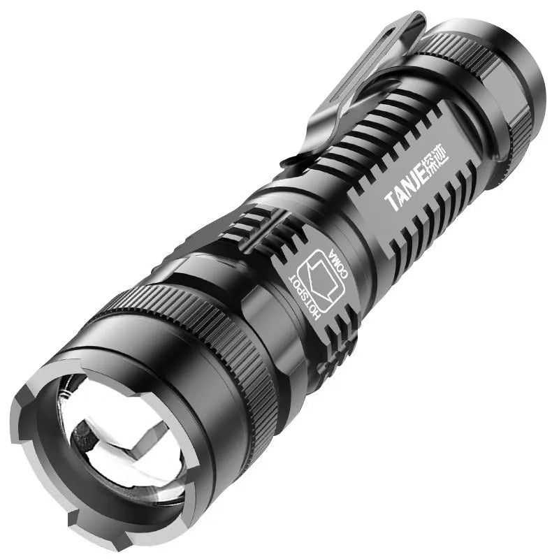 Small black aluminium telescopic LED torch with pocket clip shown extended and retracted.