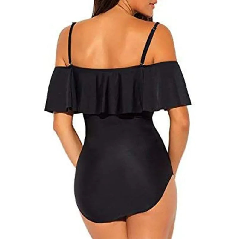 Black one-piece swimsuit with cut-out tube top and ruffled straps on a mannequin