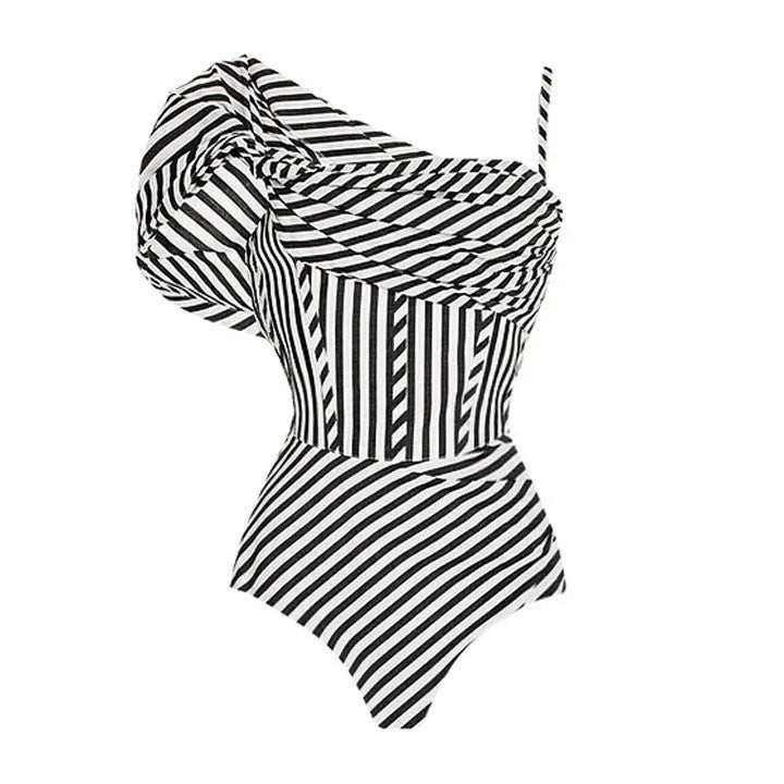 Women's striped one-piece swimsuit with ruffle detail on polyester fabric.