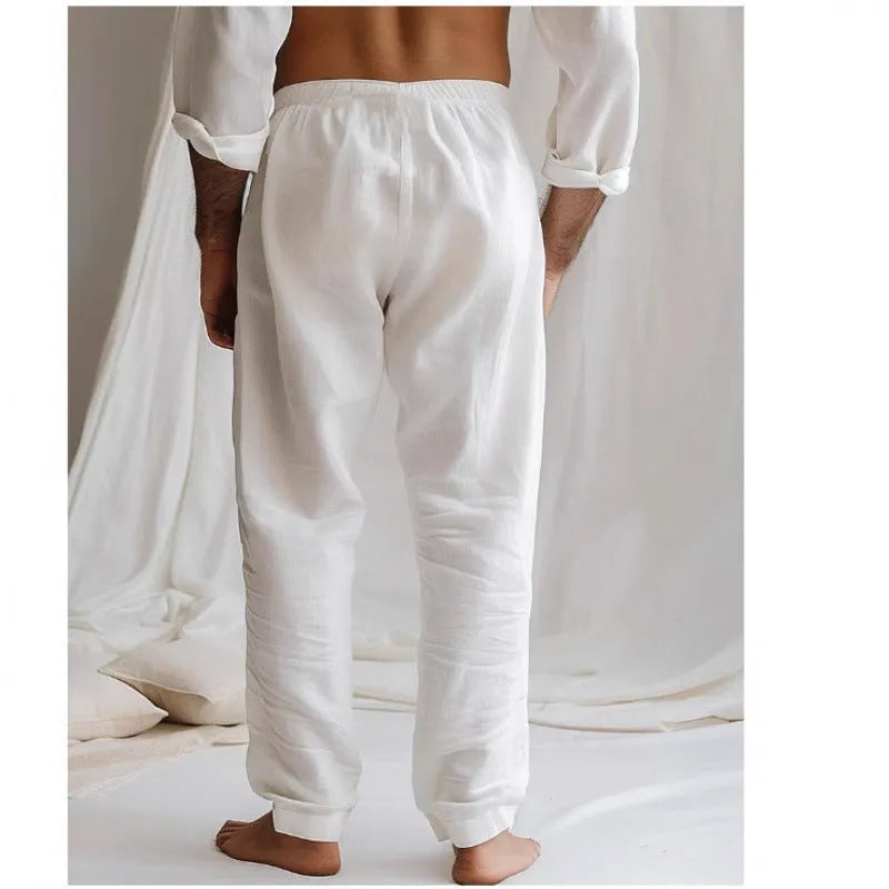 Men's light grey loose-fit cotton linen summer trousers with an elastic drawstring waist on a plain background.