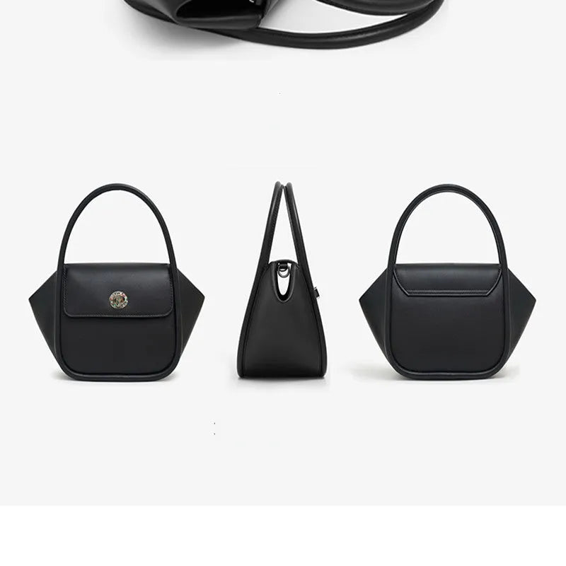 A wing-shaped women's leather tote bag with a buckle latch, shown in blue with a cross-body strap.