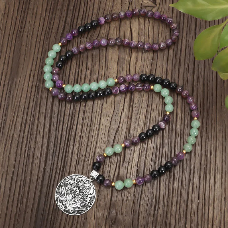 Yoga lotus pendant necklace and bracelet set with stone beads and geometric alloy pendant on adjustable chain.