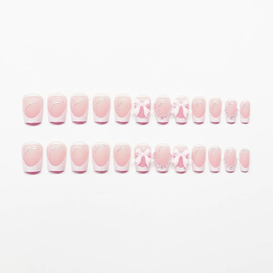 Short white square false nails with bow French manicure design and tulip patterns