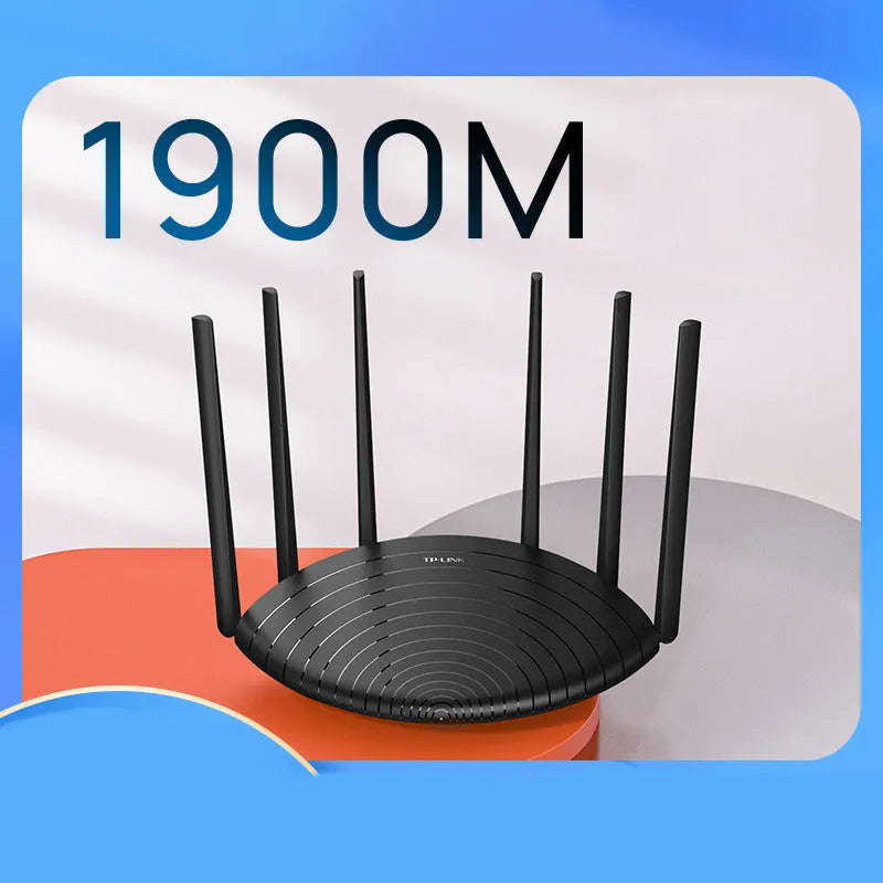 TP-Link TL-WDR7661 AC1900 wireless gigabit router on a desk, showing Ethernet ports and compact size.