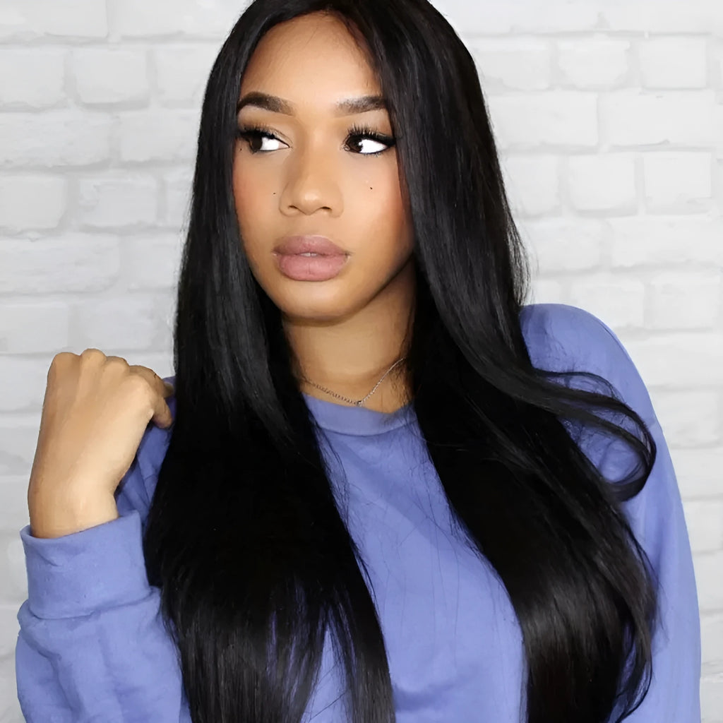 Long straight black synthetic wig on a mannequin head, featuring a centre parting and straight-cut bangs.