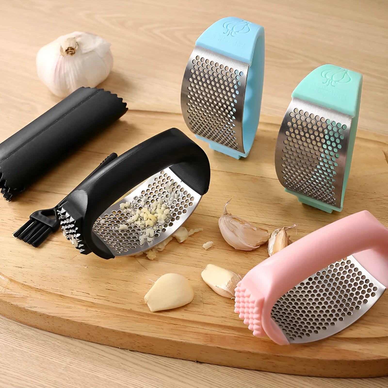 304 stainless steel garlic press in green, pink, black, or blue colour measuring 11x7cm