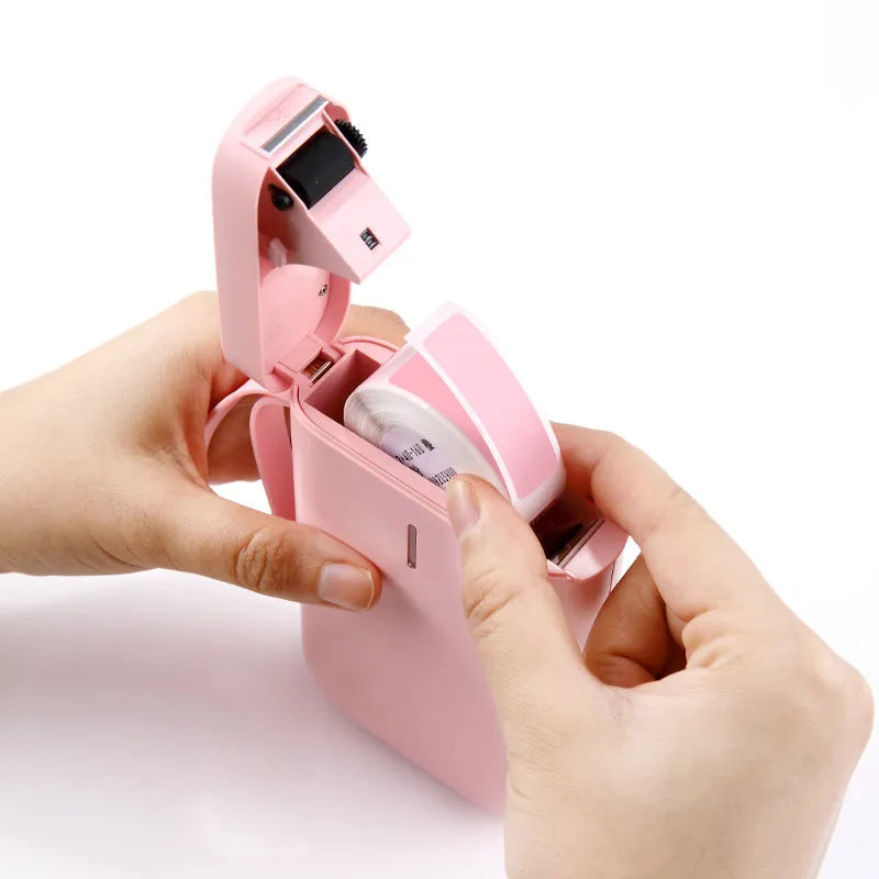 D11 Bluetooth thermal label printer in black, white, pink, green, or bundle colours, shown with smartphone running the label design app.