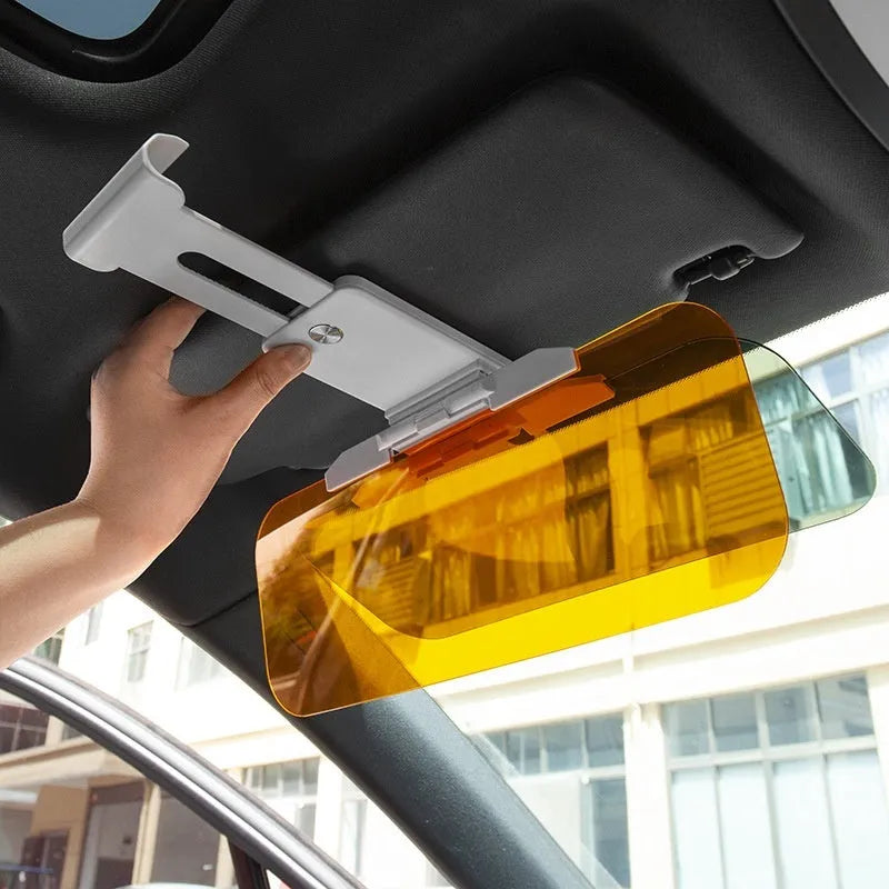 Car sun visor with anti-high beam goggles showing acrylic lens and telescopic mount for universal vehicle fit.