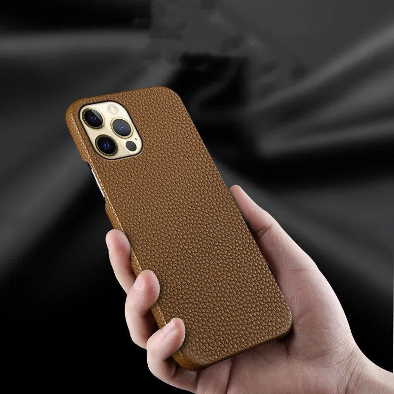Genuine brown leather shatterproof protective case for iPhone on a table.