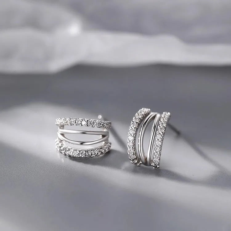 A pair of geometric-style 925 sterling silver earrings with an ethnic design, shown on a white background.