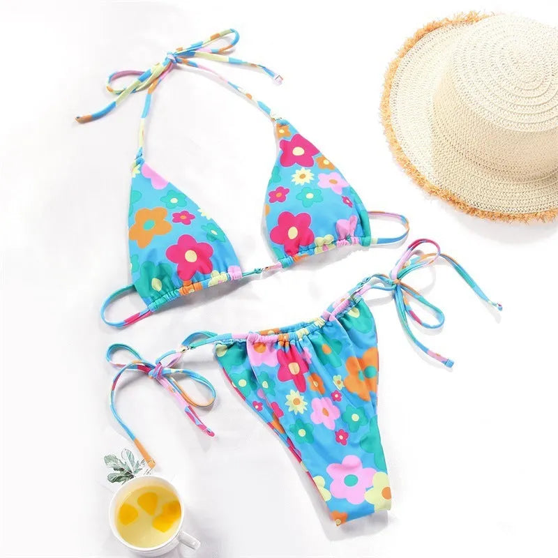 Women's polka dot print split swimsuit bikini set in polyester on a mannequin.