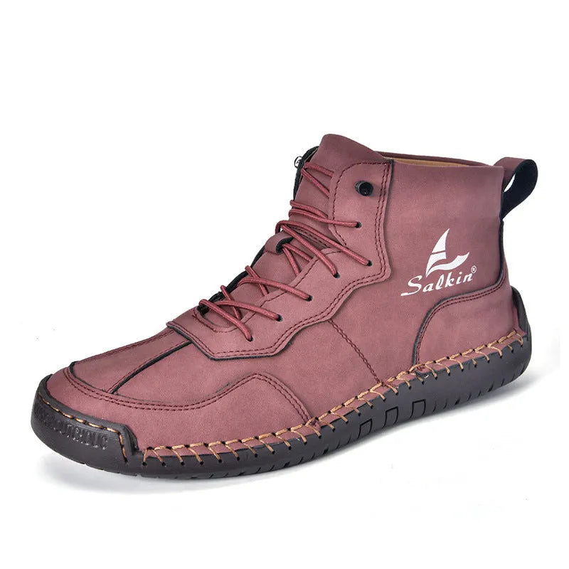 Men's dark blue retro high-top casual boots with lace-up front and elastic band on a white background.