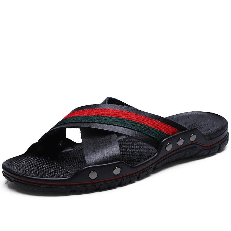 Men's white cowhide leather flip-flops with a textured non-slip PU sole on a sandy beach.