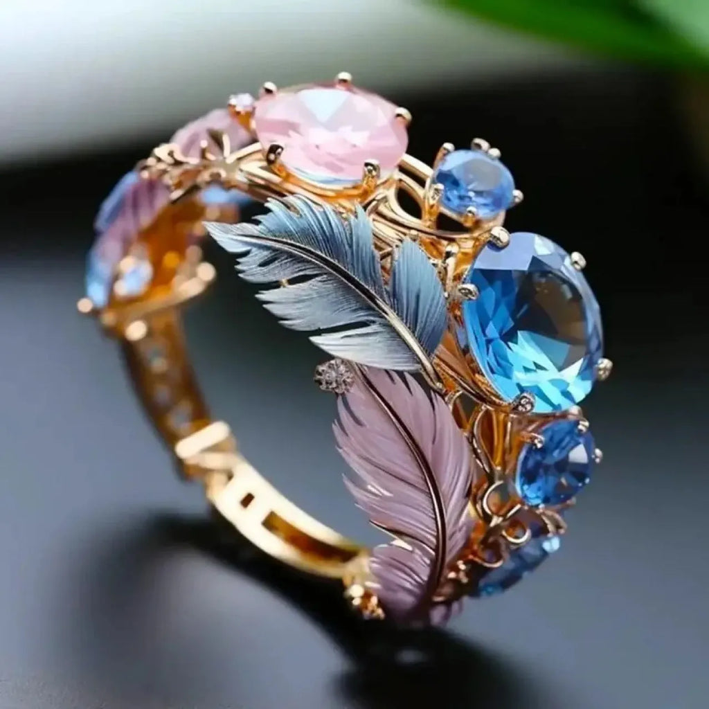 Gold colour brass feather ring with embossed design and inlaid zircon stones