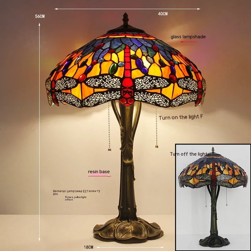 Stone table lamp with Tiffany-style blue dragonfly design on base