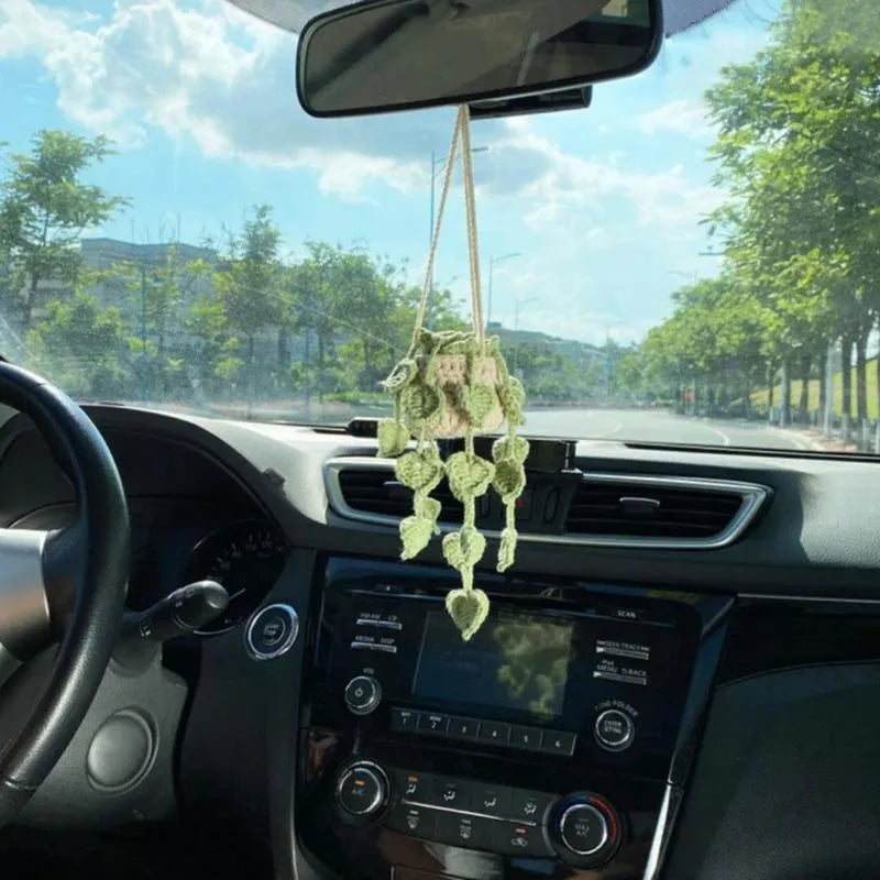 Green and white knitted car plant ornament with basin base and hanging rope