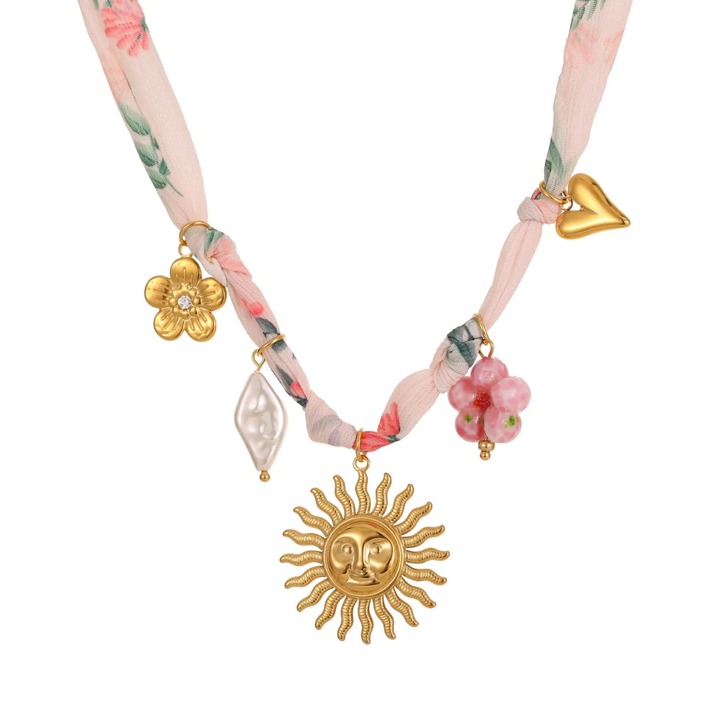 Stainless steel pendant necklace with heart or sun design on adjustable chain
