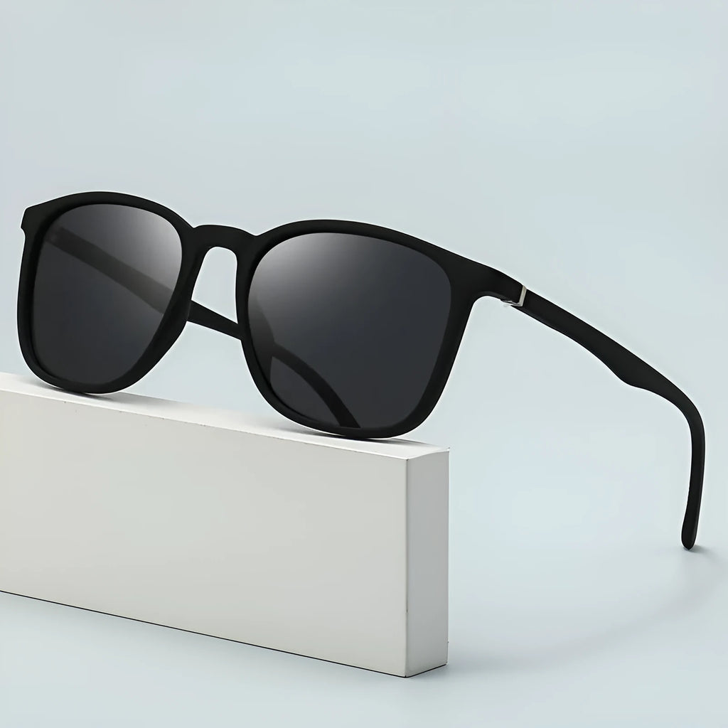 Men's polarised sunglasses with PC frame, spectacle foot design, and dark lenses showing UV400 protection