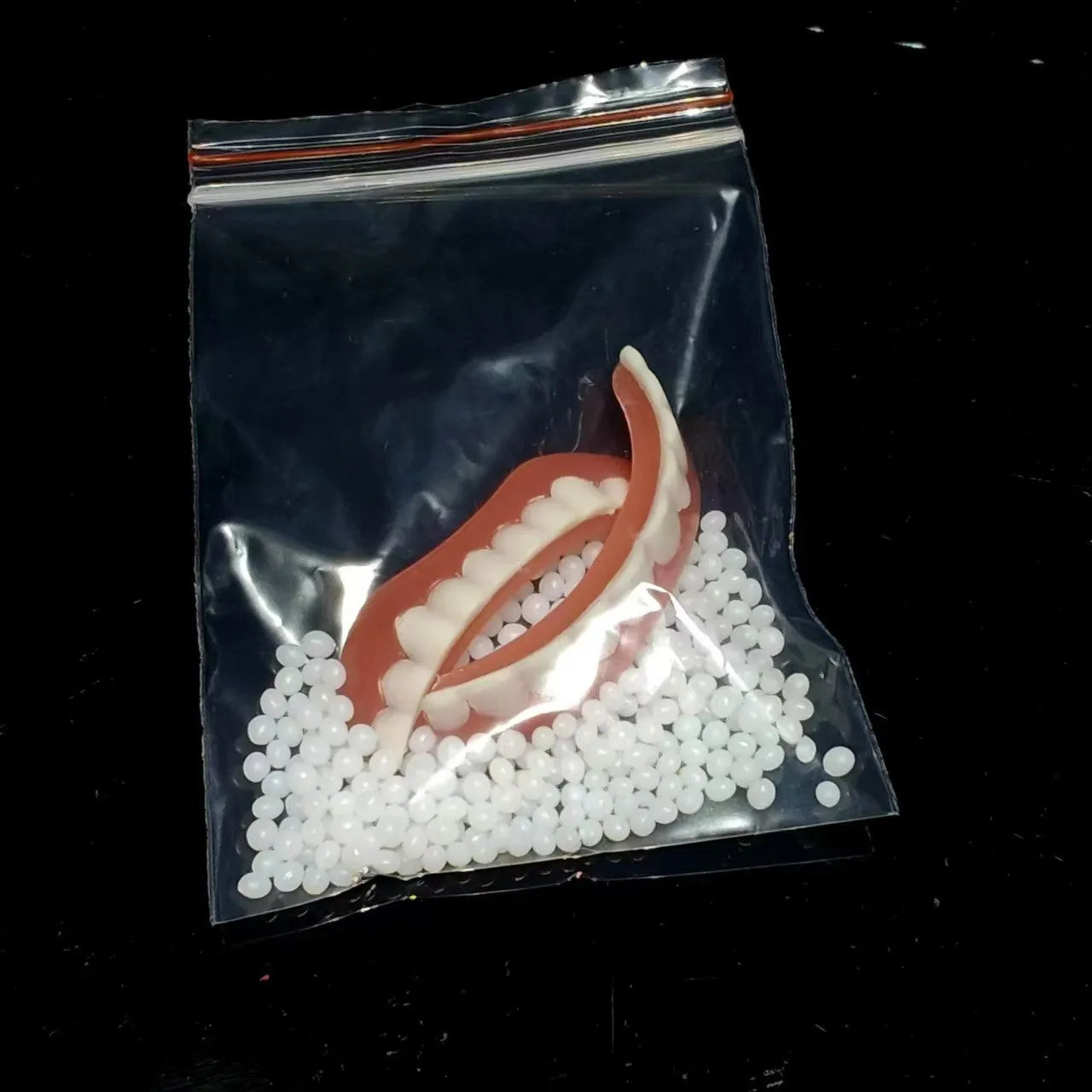 Silicone simulation smile dentures in colour box packaging for dental training
