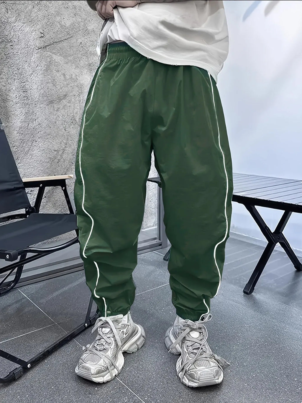 Men's loose fit cropped sports trousers in bamboo fibre, shown in khaki colour.
