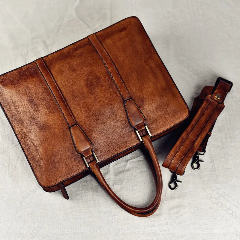 Men's brown leather horizontal square handbag with zipper opening showing 14 inch size