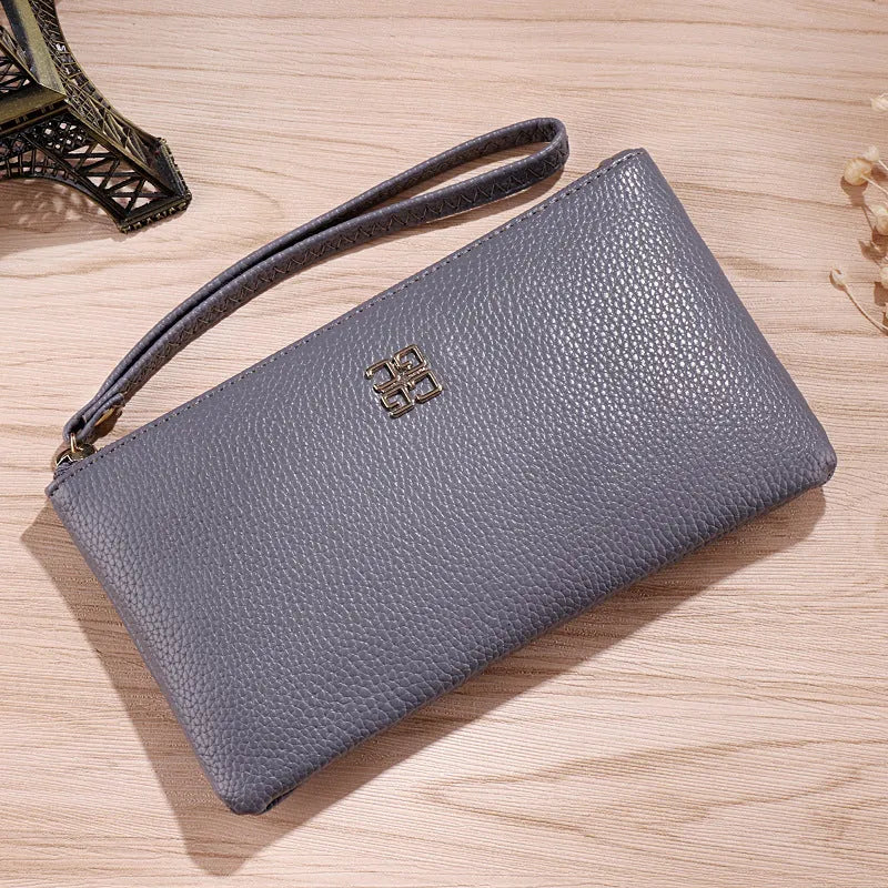 Long 55-inch PU leather phone wallet handbag with zipper closure in a solid colour.