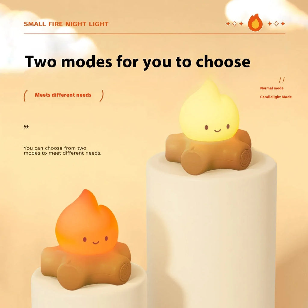 Small cartoon silicone fire pile night lamp with yellow glow on a surface