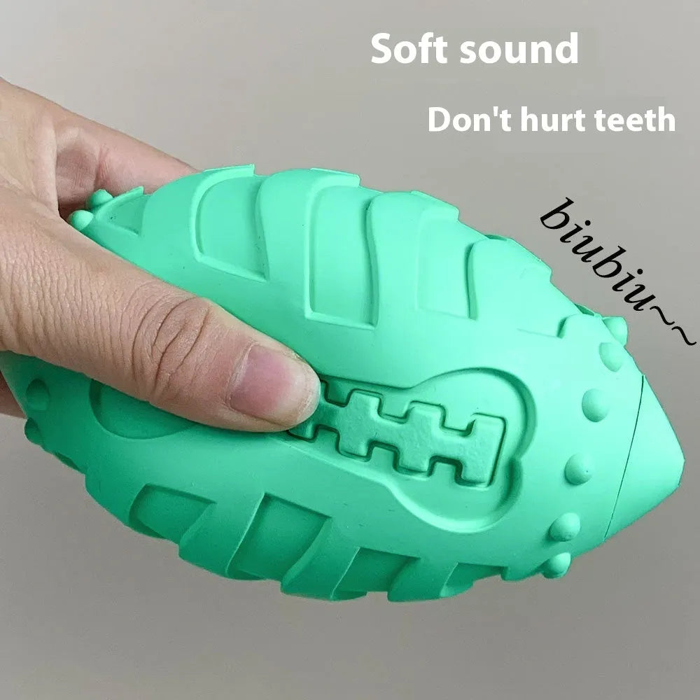 Light green thickened rubber rugby ball dog toy with squeaker for bite-resistant interactive training and teeth cleaning.