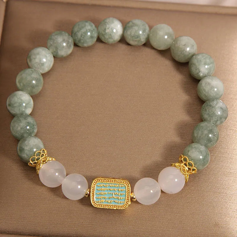 Oil green emerald crystal bracelet for women with five engraved beads.