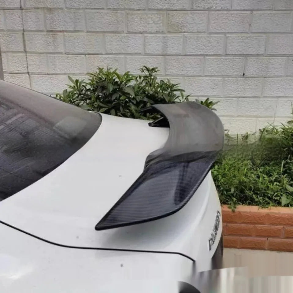 A bright black punch-free ABS plastic tail wing spoiler for cars.