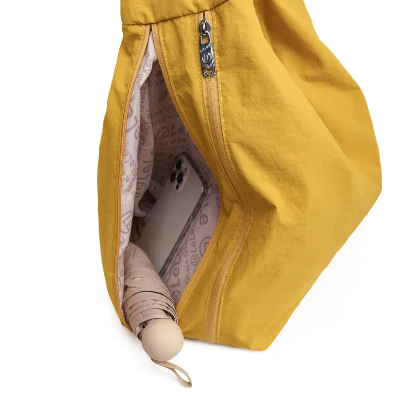 Heart-shaped nylon underarm bag for women in black, blue, khaki, and yellow colour options.