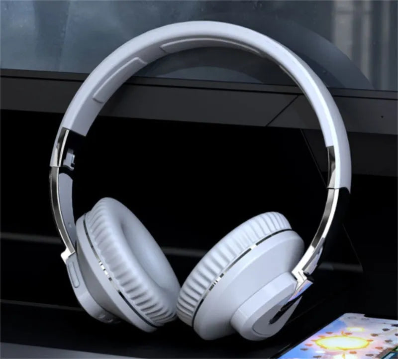 Wireless gaming headset with all-inclusive ear cushions in blue, showing AUX port and control buttons.