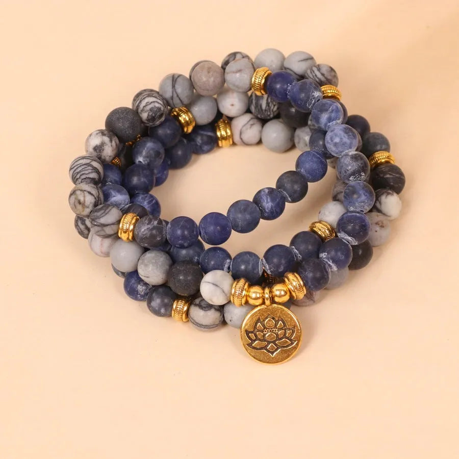 Blue multi-layer bracelet with patterned network stone beads and alloy metal components